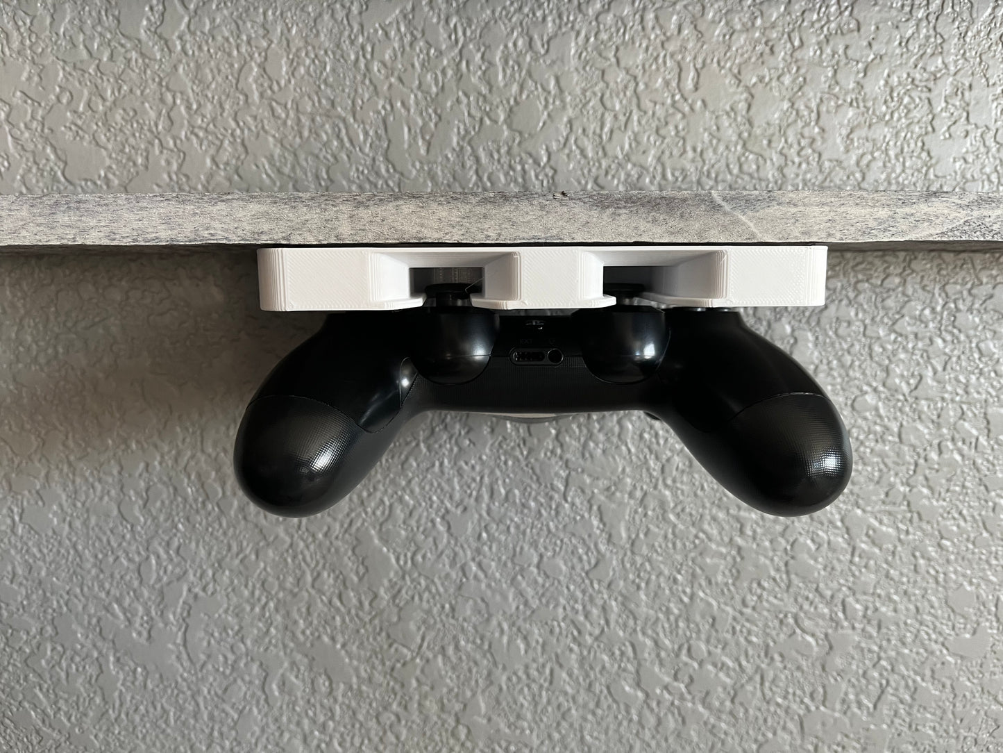 Under desk mounted ps4 and ps5 controller holder